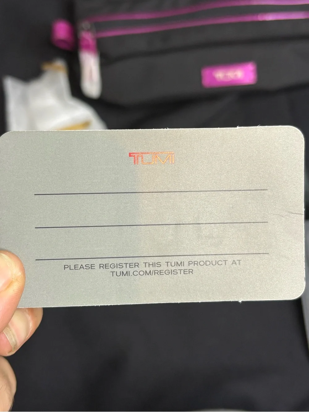Tumi Black Travel Pouch with Pink Accents